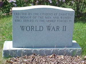 A tombstone in a cemetery

Description automatically generated