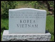 A tombstone with text on it

Description automatically generated