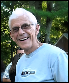 A person smiling at the camera

Description automatically generated