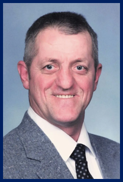 A person in a suit and tie

Description automatically generated