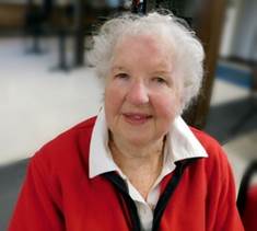 A person in a red jacket

Description automatically generated