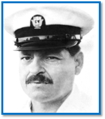 A person with a mustache wearing a white hat

Description automatically generated