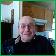 A person smiling at the camera

Description automatically generated