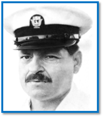 A person with a mustache wearing a white hat

Description automatically generated